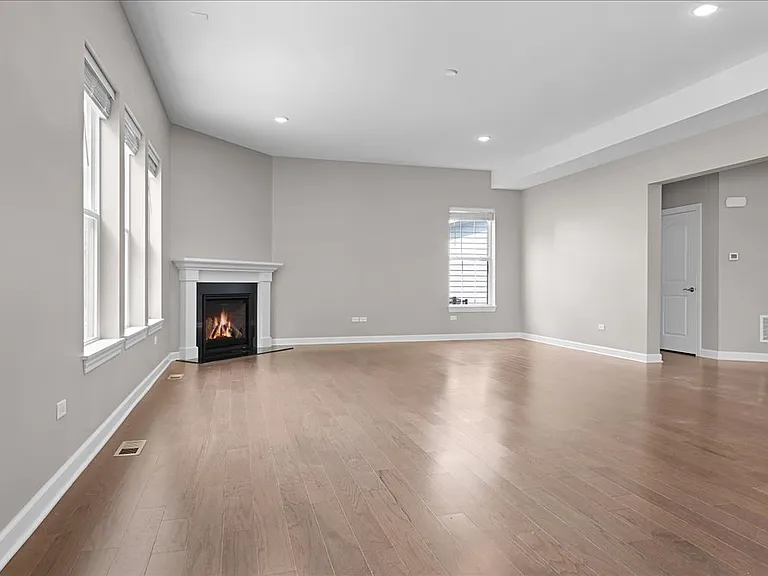 Open concept first floor with kitchen, dining room, and family room.