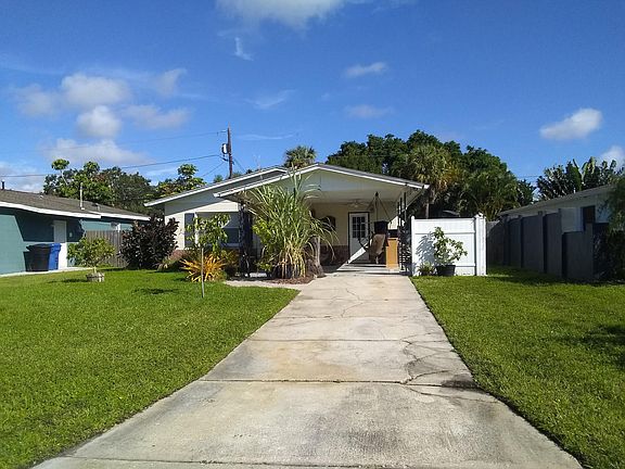 Long driveway with carport
