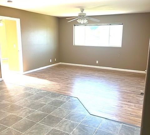 Living room with new laminate flooring and fresh paint through out.