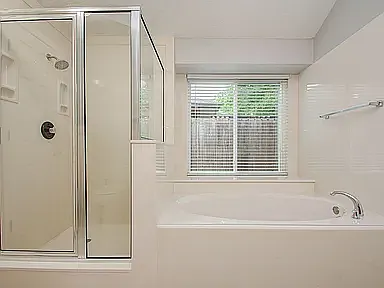 Relax and unwind in the spacious soaking tub with a nearby separate shower.