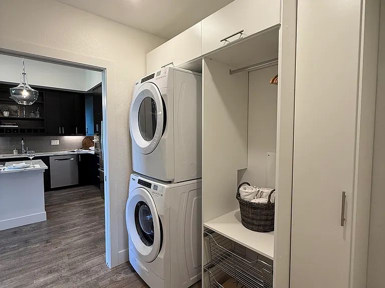 Sepparate laundry and utility room with extra storage space.