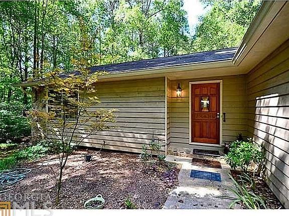 Inviting entry leads to impressive wood front door!