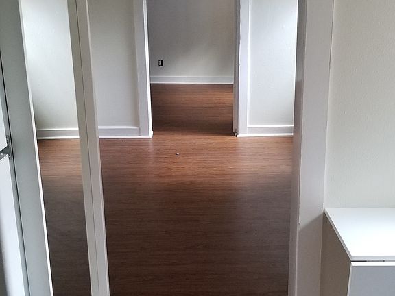 View from Kitchen, through living room, into back bedroom.