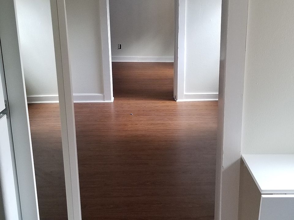 View from Kitchen, through living room, into back bedroom.