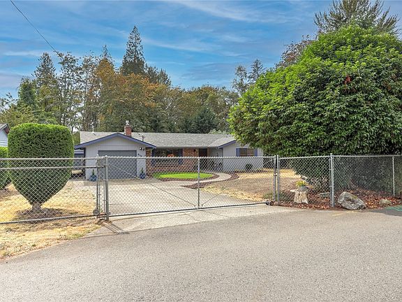 The completely fenced yard has a gate for added security and privacy.  You'll also find lots of mature landscaping that adds an even more sense of serenity and privacy. This home is a few blocks off of NE 3rd Street in Renton Highlands, so it's as if you have your own secure and secluded oasis in the midst of the hustle and bustle of the area.>