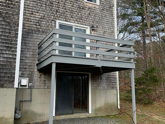 View from back yard showing walkout basement and spacious deck