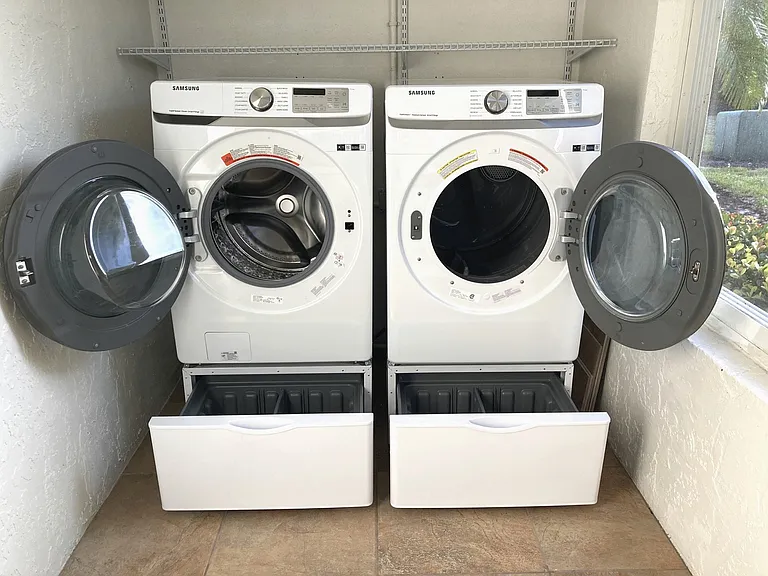 Washer / Dryer in Lanai opened with storage drawers