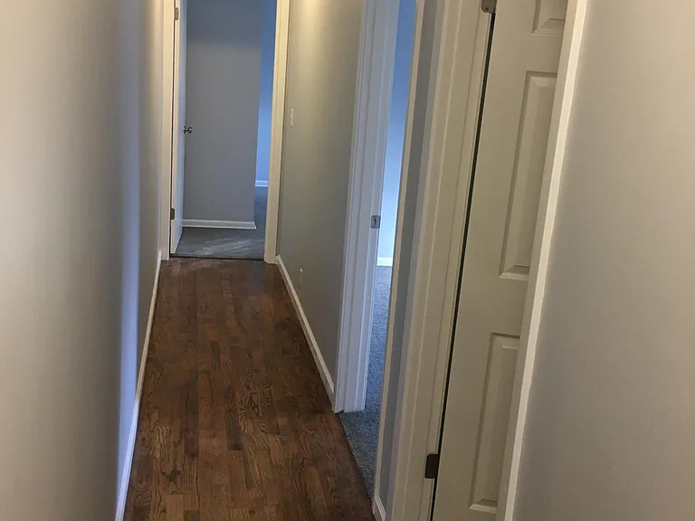 Hallway from front of unit to bathroom and bedrooms.