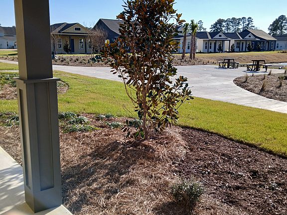 Open Front Porch overlooking pond. Fire Pit