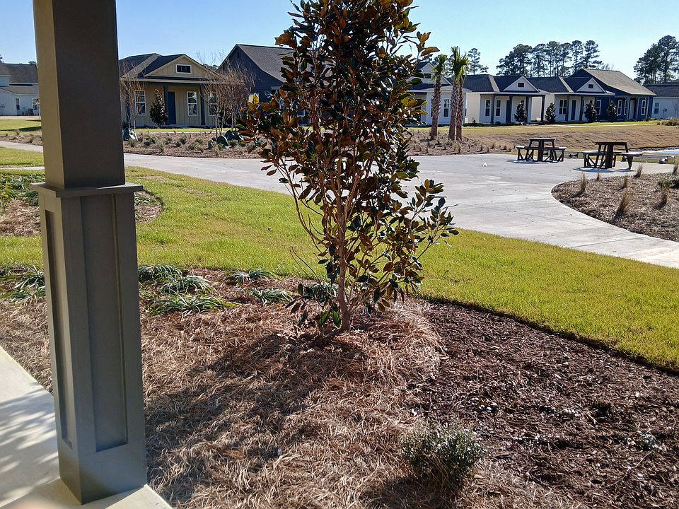 Open Front Porch overlooking pond. Fire Pit