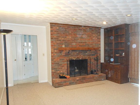 Family Room
						:
						Fireplace & bookshelf