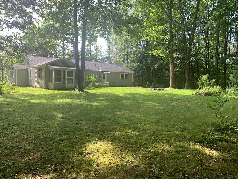 Backyard with raised gardening bed & firepit.