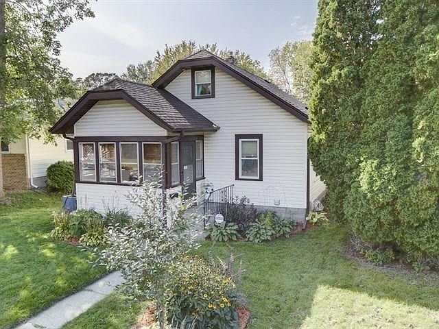 Curb appeal and charm with screened-in porch