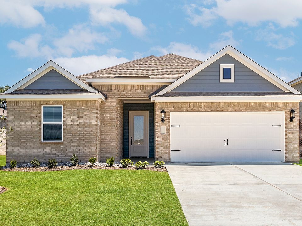 The one-story Reed floor plan has a brick exterior with siding accents.