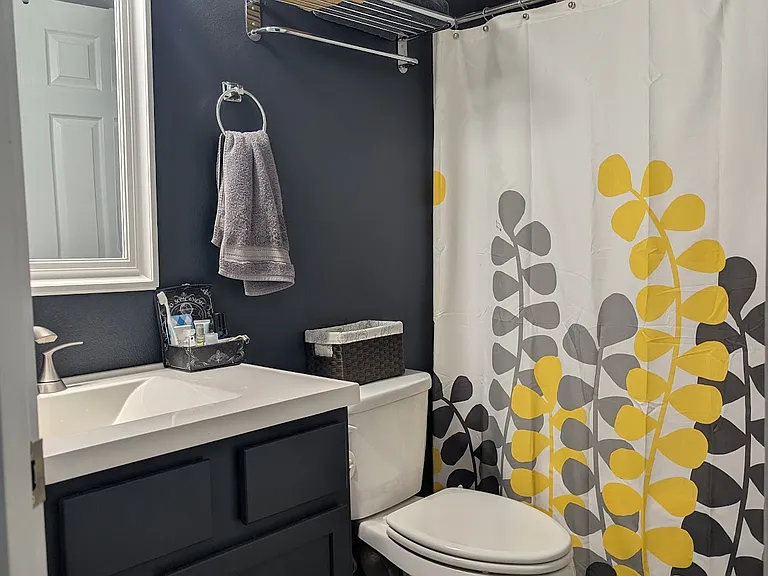 1st floor Bedroom's private bath with shower and tub.