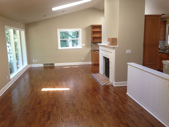 Living room with wood burning fireplace
