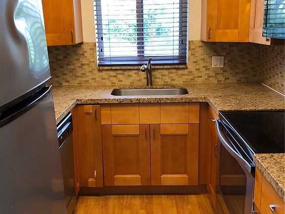 Updated kitchen with newer appliances and quartz countertop.