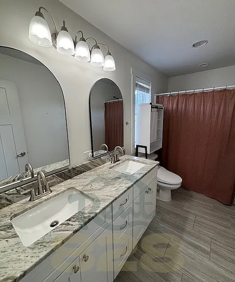 ensuite primary bathroom with double vanity