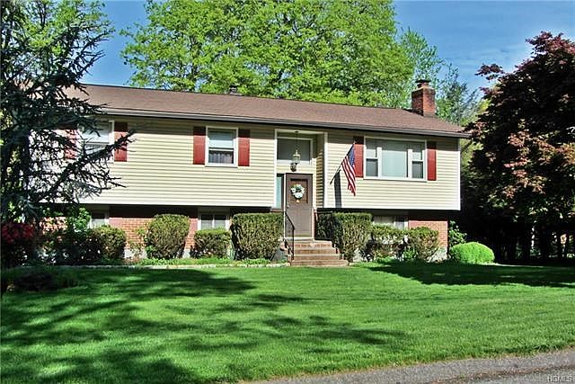 Welcome to Henning Drive.  This lovely, maintenance free home is set on a level, wooded lot.