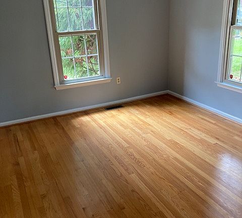 Den with wood burning fireplace