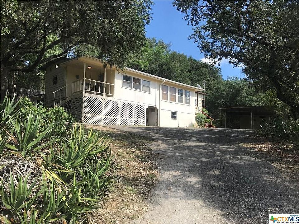 FRONT of house on hill.