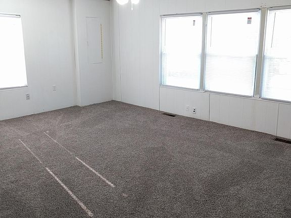 Living Room looking front and side of the house