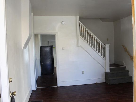 LivingRoom looking into unit toward Kitchen and 2nd floor stairs