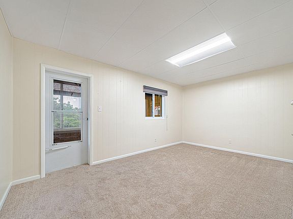 Livingroom with door leading to the sunporch.