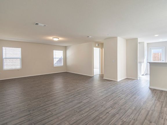 View of kitchen and dining area from gathering room