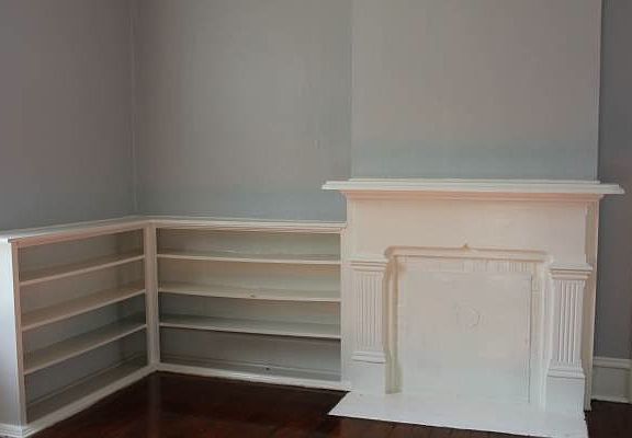 Non-working fireplace with built ins.