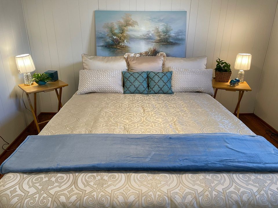 Bedroom fits King Set. Has Window, Lighted Ceiling Fan, Closet, and Hardwoods.