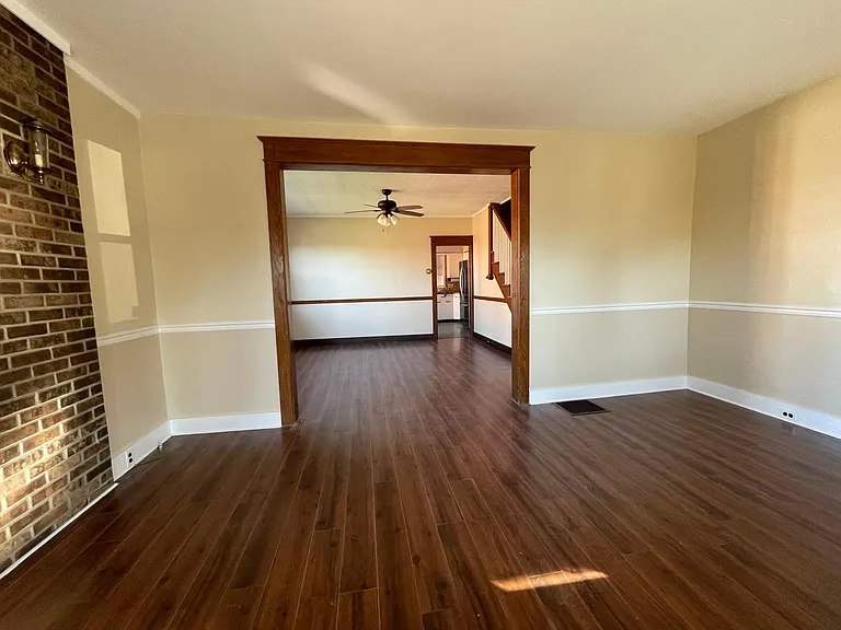 Living room into dining room flows into kitchen for open concept living.
