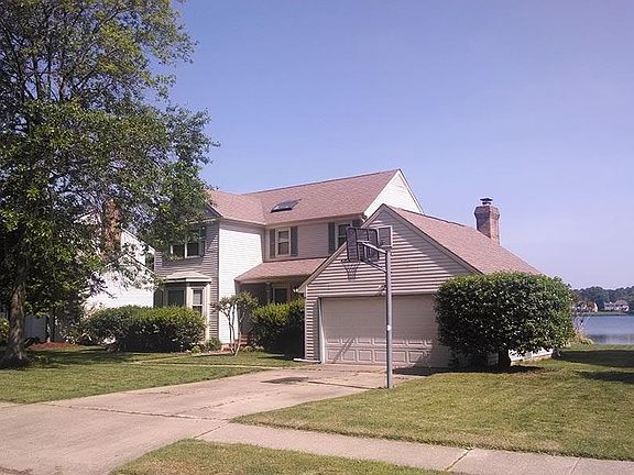 Front view w/ mature trees
