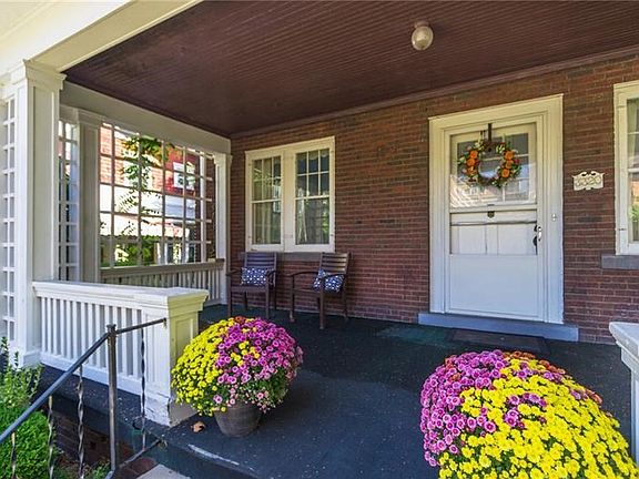 Massive covered porch with nice wood ceiling. Perfect for porch sitting any time of the day!