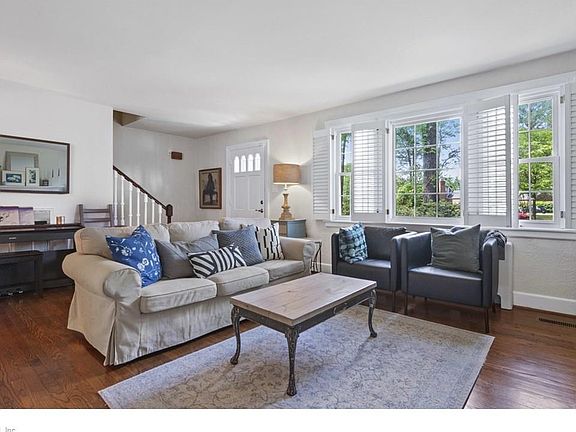 Front entrance of home and bright living room!