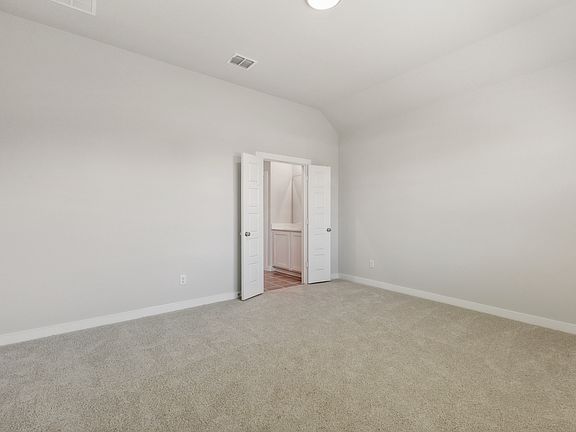 Primary Suite in the Cedar home plan by Trophy Signature Homes - REPRESENTATIVE PHOTO