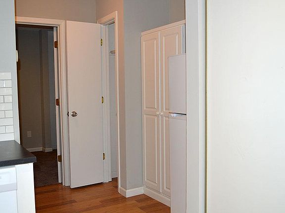 Hallway to Bathroom and Bedroom/Refrigerator and Pantry