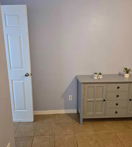 When you first enter your private suite, you'll be greeted by a beautifully arranged cabinet with drawers and a TV setup for your entertainment.
