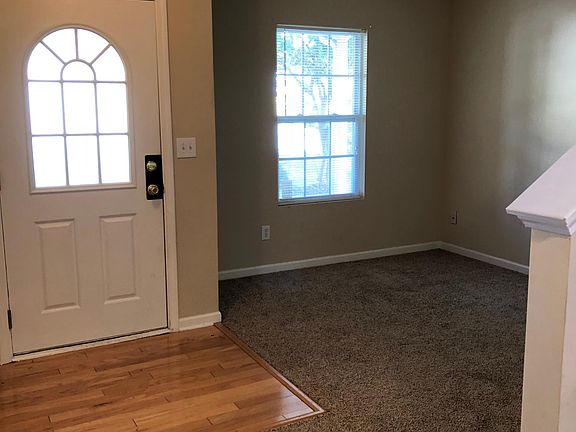 Right off the entryway is perfect office space or small livi