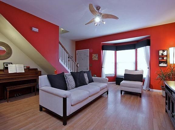 This updated living room offers updated laminate flooring.