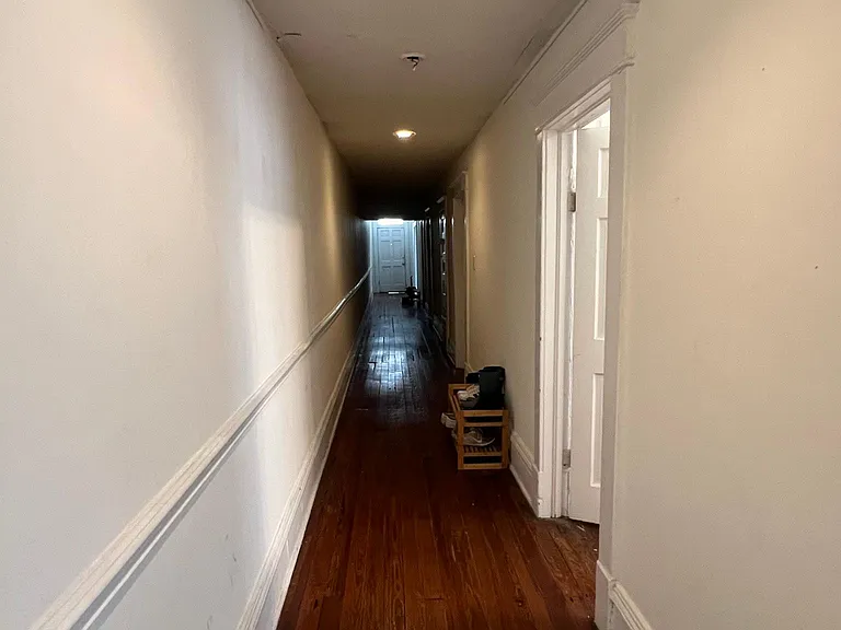 End of the hallway, facing the front door.