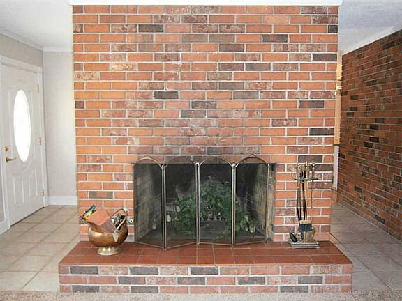 All brick fireplace makes for cozy winter evenings. 