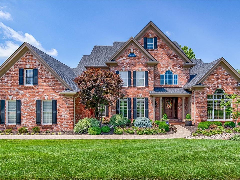 Welcome to 1422 Country Lake Estates Drive with charming curb appeal and beautiful professionally landscaped yard in front and back!