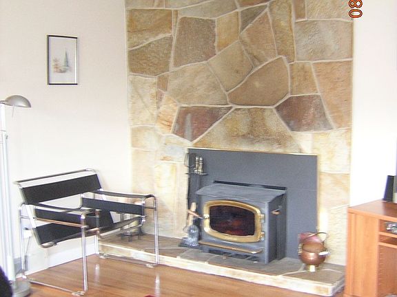 Fireplace, stone wall and woodstove insert