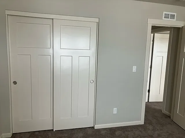 Secondary Bedroom B closed closet doors