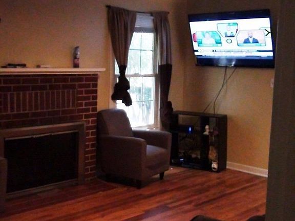 Living Room. Hardwood Floors, Ceiling Fan, Dual Pane windows.