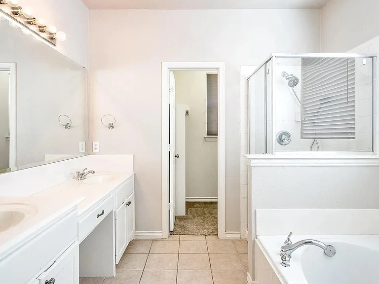 Master bathroom/His walk-in closet