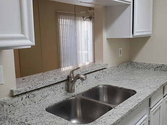 New kitchen countertop and new painted cabinets. Dishwasher and stainless steel sink included.