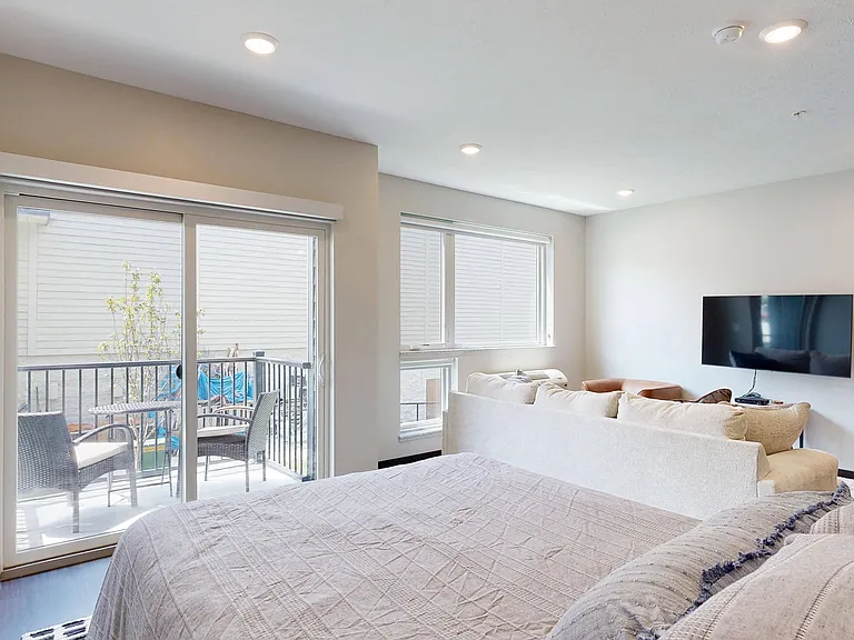 Open layouts create a seamless flow from the sleeping area to the living space, complete with large windows and balcony access.