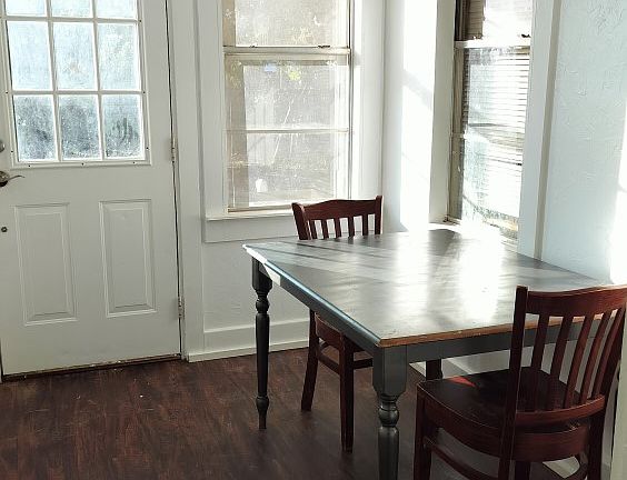 An eating area by the back door. Each individual room also has a desk and chair.